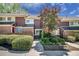 Charming townhome with brick accents and lush landscaping, creating a welcoming curb appeal at 69 Country Place Ct, Alpharetta, GA 30005