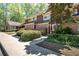Inviting townhome exterior with well-maintained landscaping and a sidewalk leading to the entrance at 69 Country Place Ct, Alpharetta, GA 30005