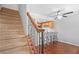 Sunlit kitchen with bar seating, wood cabinets, and hardwood floors at 69 Country Place Ct, Alpharetta, GA 30005