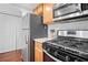 Updated kitchen with stainless steel appliances, granite countertops, and modern cabinetry at 69 Country Place Ct, Alpharetta, GA 30005