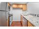 Updated kitchen with stainless steel appliances, granite countertops and new cabinets at 69 Country Place Ct, Alpharetta, GA 30005