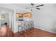 Cozy kitchen with breakfast bar, stainless appliances, pendant lights, and hardwood floors at 69 Country Place Ct, Alpharetta, GA 30005