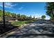 Scenic street view of a well-maintained community with landscaped flower beds and lush greenery at 69 Country Place Ct, Alpharetta, GA 30005