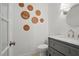 Stylish powder room with unique wall decor and modern vanity at 7000 Hunters Knl, Atlanta, GA 30328