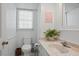 Cozy bathroom featuring marble countertop and vintage fixtures at 7000 Hunters Knl, Atlanta, GA 30328