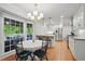 Open dining area with large windows for natural light and hardwood floors at 7000 Hunters Knl, Atlanta, GA 30328