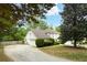 Well maintained home with a two car garage, mature landscaping, and a long driveway at 7000 Hunters Knl, Atlanta, GA 30328