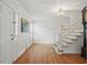 Inviting foyer with hardwood floors, staircase, and natural light streaming in at 7000 Hunters Knl, Atlanta, GA 30328