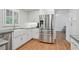 Updated kitchen with stainless steel refrigerator and white countertops at 7000 Hunters Knl, Atlanta, GA 30328