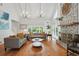 Spacious living room featuring a stone fireplace and an abundance of natural light at 7000 Hunters Knl, Atlanta, GA 30328