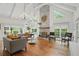Bright living room with stone fireplace, vaulted ceilings, and hardwood floors at 7000 Hunters Knl, Atlanta, GA 30328