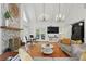 Open living room with stone fireplace, hardwood floors, and plenty of seating at 7000 Hunters Knl, Atlanta, GA 30328