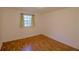 Bright bedroom featuring hardwood flooring and a large window with ample natural light at 1181 Church St # D, Decatur, GA 30030