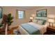 Bright bedroom featuring hardwood flooring, a queen bed and a tranquil blue color scheme at 1181 Church St # D, Decatur, GA 30030