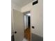 Hallway with a louvered closet and tile flooring at 1181 Church St # D, Decatur, GA 30030