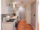 Efficient kitchen featuring white appliances, ample cabinet space, and hardwood floors for a clean, functional design at 1181 Church St # D, Decatur, GA 30030