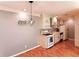 Bright kitchen with white cabinets, gas range, and adjacent dining area at 1181 Church St # D, Decatur, GA 30030