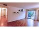 Spacious living room with hardwood floors and sliding glass door to a patio at 1181 Church St # D, Decatur, GA 30030