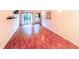 Open-plan living room with hardwood floors, sliding glass doors, and stylish accents at 1181 Church St # D, Decatur, GA 30030