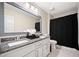 Bathroom featuring a double vanity with granite countertops and a shower with a black curtain at 3200 Hampton Ridge Way, Snellville, GA 30078