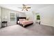 Bedroom featuring neutral walls, carpet, a ceiling fan, and natural light at 3200 Hampton Ridge Way, Snellville, GA 30078