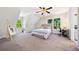 Bright bedroom with slanted ceilings, carpet, and natural light at 3200 Hampton Ridge Way, Snellville, GA 30078