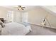 Cozy bedroom featuring neutral carpet, a ceiling fan, and multiple doorways at 3200 Hampton Ridge Way, Snellville, GA 30078