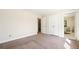 Neutral carpet in bedroom with access to bathroom and closet at 3200 Hampton Ridge Way, Snellville, GA 30078