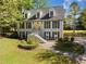 Charming two-story brick home with a meticulously maintained lawn and mature trees at 3200 Hampton Ridge Way, Snellville, GA 30078
