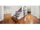 Inviting foyer with hardwood floors, staircase, and decorative mirror at 3200 Hampton Ridge Way, Snellville, GA 30078
