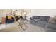 Living room with plush seating, stylish decor, and an open view to the foyer and staircase at 3200 Hampton Ridge Way, Snellville, GA 30078