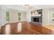 Spacious living room with hardwood floors and a cozy fireplace at 3200 Hampton Ridge Way, Snellville, GA 30078
