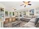 Inviting living room with hardwood floors, large sectional sofa, and an abundance of natural light at 3200 Hampton Ridge Way, Snellville, GA 30078