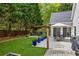 Backyard with patio, a dining table under an umbrella, and a wooden pergola at 3601 Cedar Springs Ln, Loganville, GA 30052