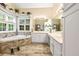 Spa-like bathroom with a soaking tub, dual sinks, and modern fixtures at 3601 Cedar Springs Ln, Loganville, GA 30052