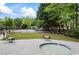 View of the community picnic and playground area surrounded by trees, grassy area and fence at 3601 Cedar Springs Ln, Loganville, GA 30052