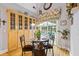 Cozy dining area featuring wood floors, built-in cabinets, and sliding glass doors to the patio at 3601 Cedar Springs Ln, Loganville, GA 30052