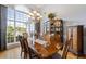 Elegant dining room with large window, hardwood floors, and a stunning chandelier at 3601 Cedar Springs Ln, Loganville, GA 30052