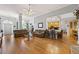 Spacious living room featuring hardwood floors, neutral colors, and seamless flow into the kitchen at 3601 Cedar Springs Ln, Loganville, GA 30052