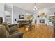 Spacious living room featuring hardwood floors, fireplace, and plenty of natural light at 3601 Cedar Springs Ln, Loganville, GA 30052