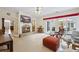 Open living room featuring a fireplace, neutral tile floors, and a sliding door to outdoor patio at 3601 Cedar Springs Ln, Loganville, GA 30052