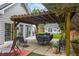 Outdoor patio with pergola offers a shady spot for dining and relaxing outdoors at 3601 Cedar Springs Ln, Loganville, GA 30052