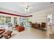 Bright sunroom with tile floors, numerous windows and a view of the outdoor area and an adjacent bathroom at 3601 Cedar Springs Ln, Loganville, GA 30052