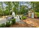 Sprawling backyard featuring patio dining, fireplace, and play structure, perfect for Gathering fun at 568 Timberland Dr, Atlanta, GA 30342