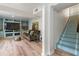 Finished basement area with built-ins, comfortable seating, and modern flooring at 568 Timberland Dr, Atlanta, GA 30342