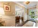 Inviting foyer with hardwood floors, elegant wallpaper, and a view into the spacious living room at 568 Timberland Dr, Atlanta, GA 30342