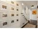 Hallway with art gallery wall, stairs, and dark hardwood floors at 568 Timberland Dr, Atlanta, GA 30342