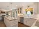 Bright kitchen featuring a spacious island with marble countertops and stainless steel appliances at 568 Timberland Dr, Atlanta, GA 30342