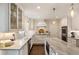 Well-lit kitchen with marble countertops, custom cabinets, stainless appliances and updated finishes at 568 Timberland Dr, Atlanta, GA 30342