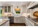 Bright and modern kitchen with stainless steel appliances, stone countertops and herringbone backsplash at 568 Timberland Dr, Atlanta, GA 30342